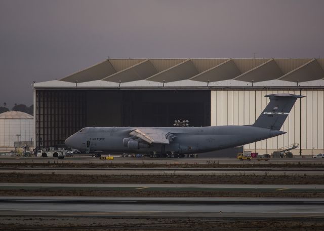 Lockheed C-5 Galaxy (N80216) - Moving a Galaxy from the freight area to remote parking. Photo taken from El Segundo overlook. Sunset 17 Sept 13 Los Angeles, California USA