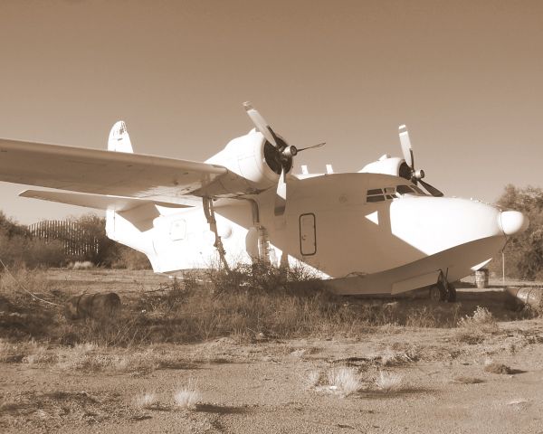 — — - Seaplane parked in storage at Evergreen Maintenance Center in Marana AZ. Photo done in Sepia.