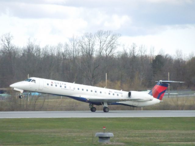 Embraer ERJ-145 (N577RP) - This little ERJ rotates off runway 22 at KROC.