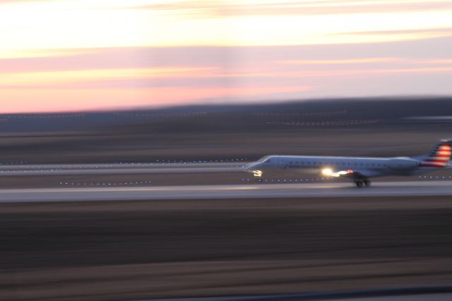 Canadair Regional Jet CRJ-900 — - An American Eagle CRJ landing on 18L at KCVG.