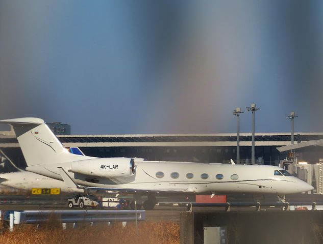 Gulfstream Aerospace Gulfstream IV (4K-LAR) - Photo taken on Jan 08, 2023.br /This is a shot through a wire fence.