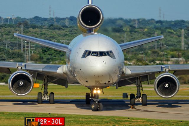 Boeing MD-11 (N613FE) - Exiting 30L after arrival.