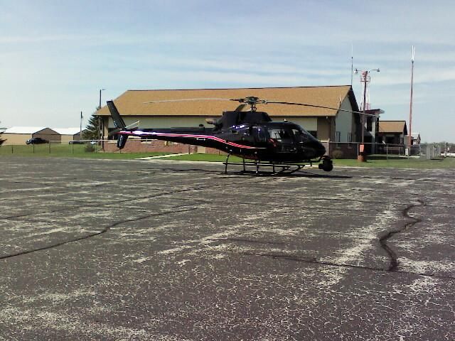 — — - A helicopter used to inspect high tension power transmission lines in and around Wisconsin/Michigan. Stopping over for a brief rest at KSUE.