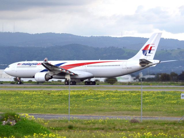 Airbus A330-300 (9M-MTC) - Rolling for take off on runway 05, for flight home to Kuala Lumpur, just before the arrival of a rain storm. Thursday 12th July 2012.