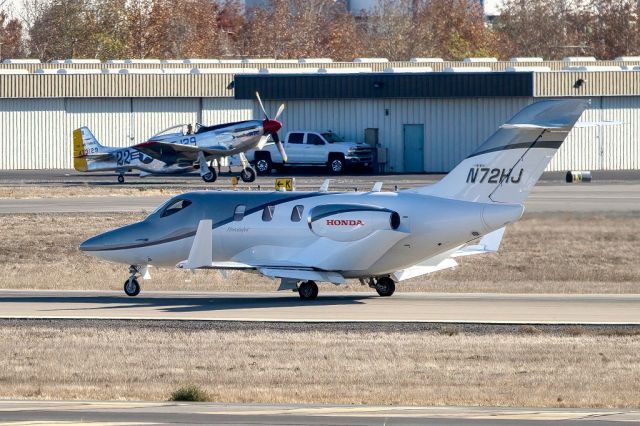 Honda HondaJet (N72HJ) - HondaJet HA-420 with North American P-51D in background