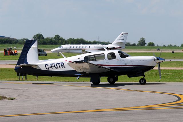 Mooney M-20 (C-FUTR) - Sharp Canadian Mooney pulling into the Atlantic ramp after a flight in from Missouri