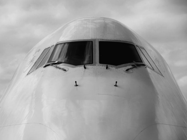 Boeing 747-400 — - The Queen, Delta Airlines 747 peers in at Detroit Metro Airport, famous for the 747 photos in front of the fountain.