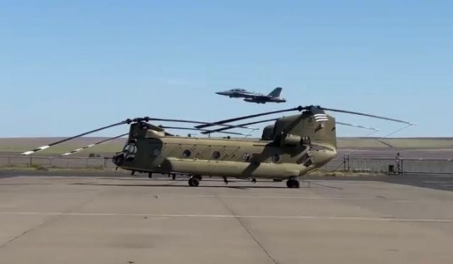 — — - F/18 takes off over Army National Guard Chinook Helicopter as it departs KPDT ðºð¸