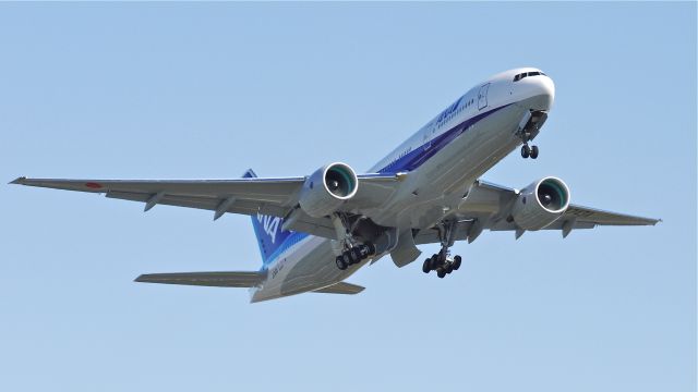 Boeing 777-200 (JA743A) - BOE593 climbs from runway 16R beginning a flight test on 3/25/13. (LN:1090 cn 40902).