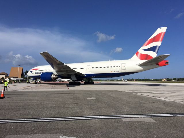 Boeing 777-200 (G-YMME) - British Airways B777-200 getting tow in to the ramp.