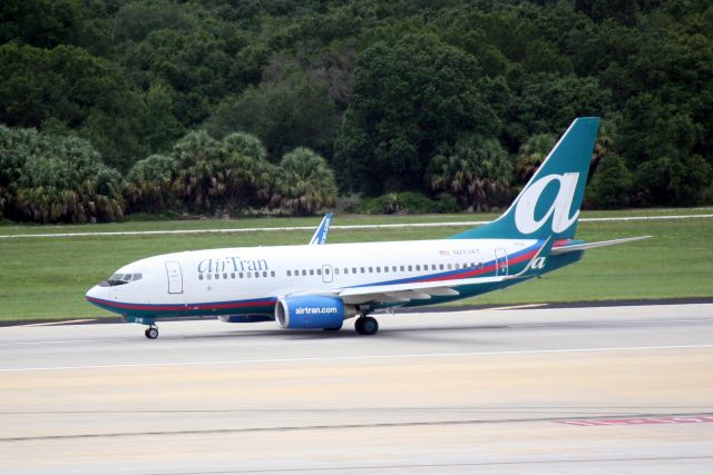 Boeing 737-700 (N273AT) - AirTran Flight 1073 (N273AT) departs Runway 19R at Tampa International Airport enroute to Baltimore-Washington International Airport