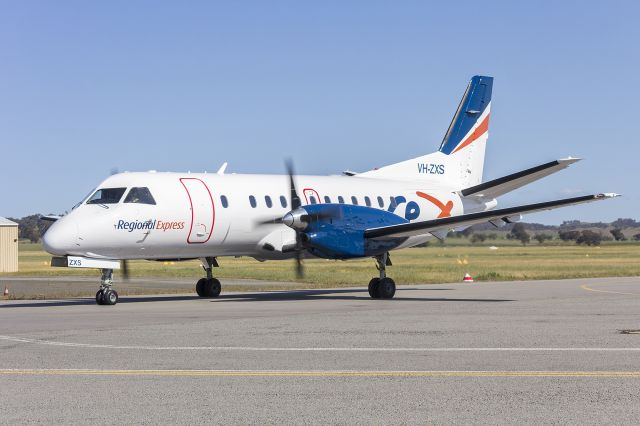 Saab 340 (VH-ZXS) - Regional Express (VH-ZXS) Saab 340B taxiing after an engine run at Wagga Wagga Airport. ZXS use to wear the green version of the Happy Air livery, now wearing the new modified REX livery.