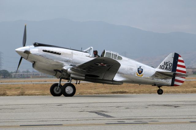 N80FR — - A rarely seen P-40B Tomahawk taxis by after a few times around the pattern at the 2013 Chino Airshow. Dig that absolutely beautiful polished aluminum finish! 