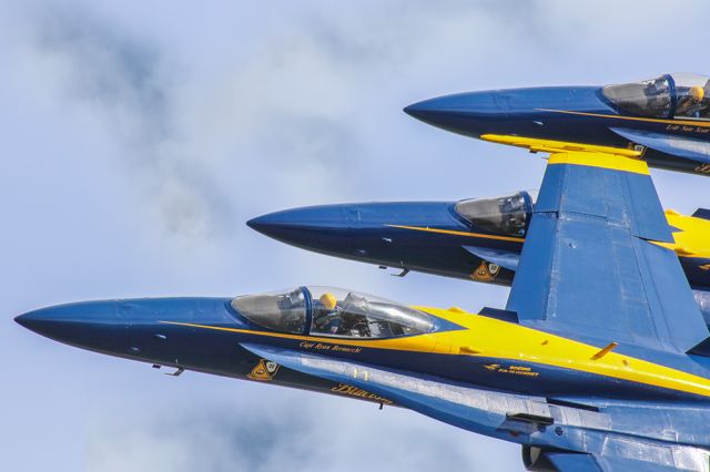 McDonnell Douglas FA-18 Hornet — - This photo really captures the precision that the Blue Angels fly with. The F18's appear to be stacked right on to of each other, when in all actuality, they are stacked right on top of each other! I Shot this photo at "Wings over North Georgia" air show at the Rome airport. I shot this with my Canon 600mm lens. My camera settings were Shutter 1/8000, F5.6, ISO 1000. Please check out my other aviation photography. Votes and positive comments are always appreciated. Questions about this photo can be sent to Info@FlewShots.com