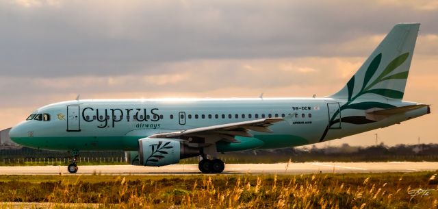 Airbus A319 (5B-DCW) - Cyprus Airways catch the summer setting sun before takeoff