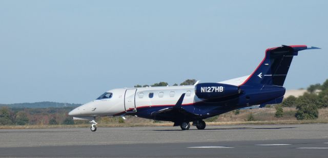 Embraer Phenom 300 (N127HB) - Taxiing to parking is this 2012 Embraer Phenom 300 in the Autumn of 2022.