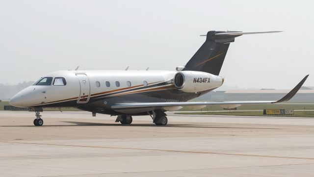 Embraer Legacy 450 (N434FX) - With the haze from Canada hanging around for a few days, it made for a great back drop for this Flexjet E545 that was sitting on the ramp at KPPO.