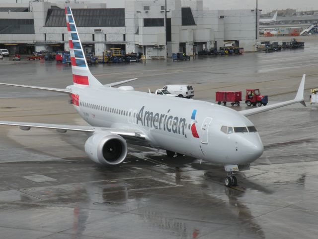 Boeing 737-800 (N314RH) - on a moving ramp in Miami, thus the reason for cutting off some of the wing