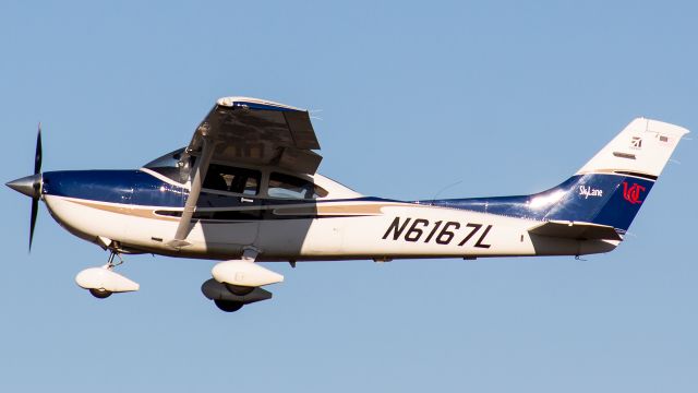 Cessna Skylane (N6167L) - Nice looking 182 Skylane rotating off rwy 22 with some nice, clear fall lighting 