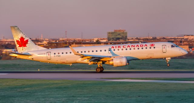 Embraer ERJ-190 (C-FNAI) - Sun just peeking over the Eastern horizon lighting up this Air Canada Embraer on runway 33L