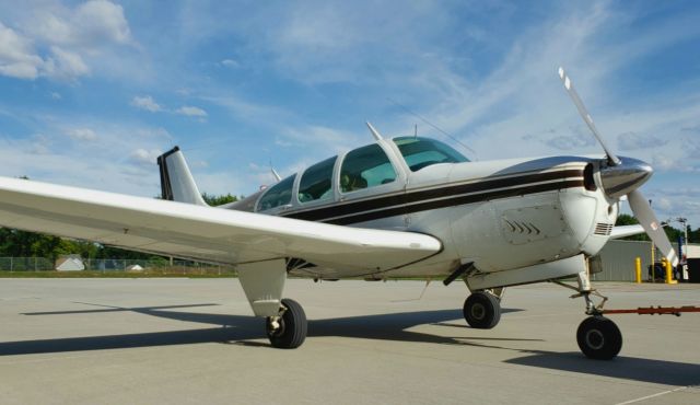 Beechcraft Bonanza (33) (N909CB) - Low shot with tow