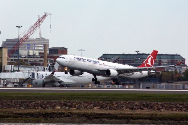 Airbus A330-300 (TC-JOF) - Turkish A330-300 landing 15R with Qatar A350-900 (A7-ALZ) in One World livery at Terminal E.