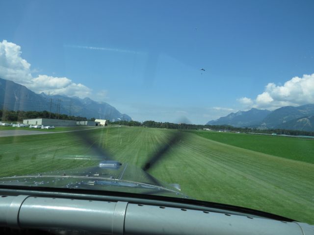 Pilatus PC-6B Turbo-Porter (HB-FLI) - Landing on the turf runway before the skydivers we dropped off. The Porter is famous for its own "skydiving".