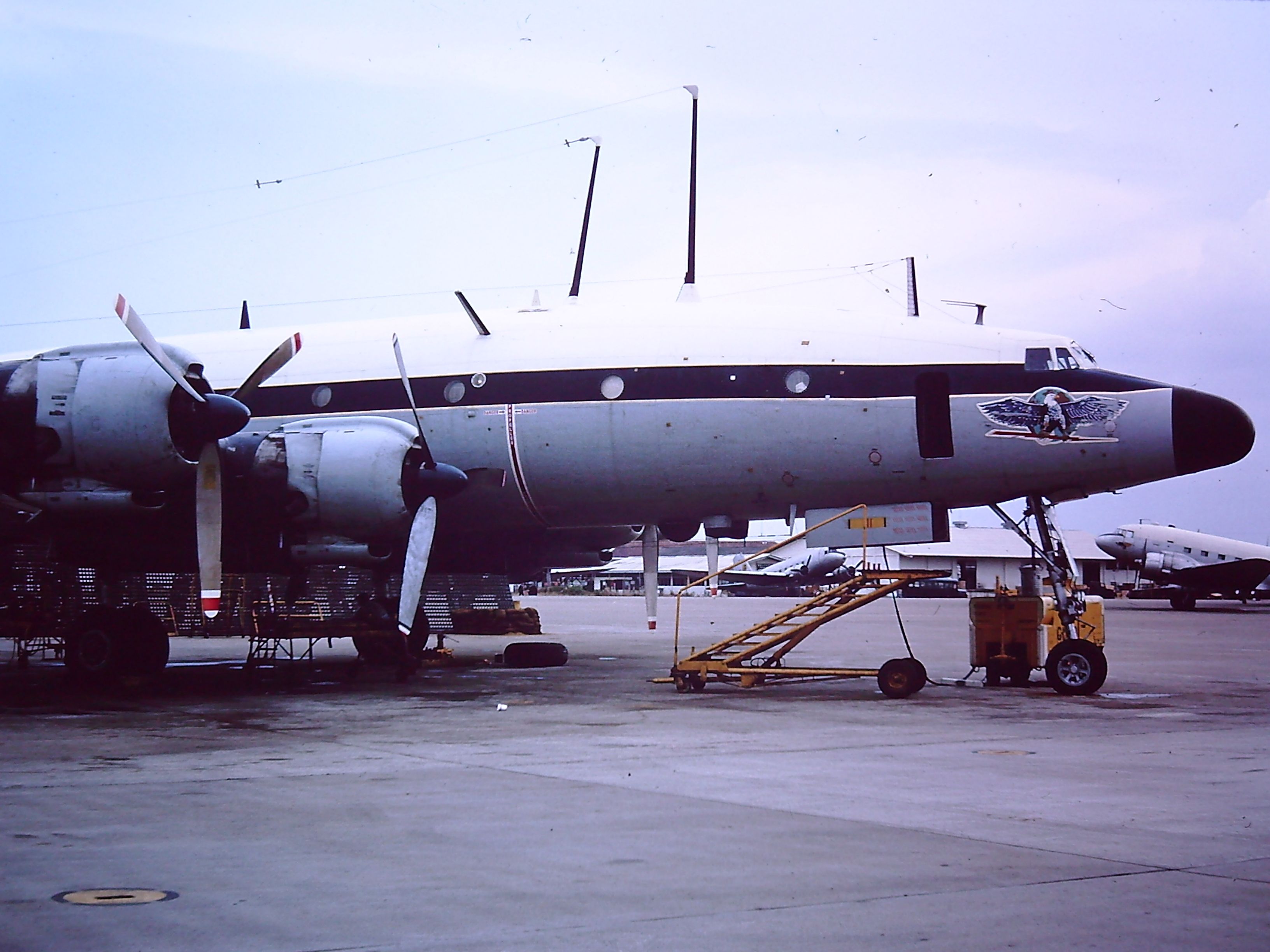 — — - TAN SON NHUT AIR BASE, SAIGON, VIETNAM 1966.  A Lockheed Constellation on the ramp and I dont know much more about her than that.  Also, notice the Vietnam Service Ribbon on the nose wheel door.