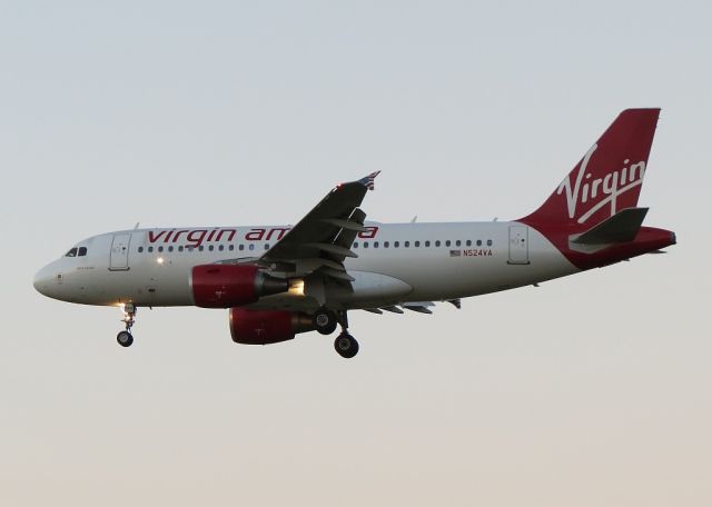 Airbus A319 (N524VA) - Arriving after sunset