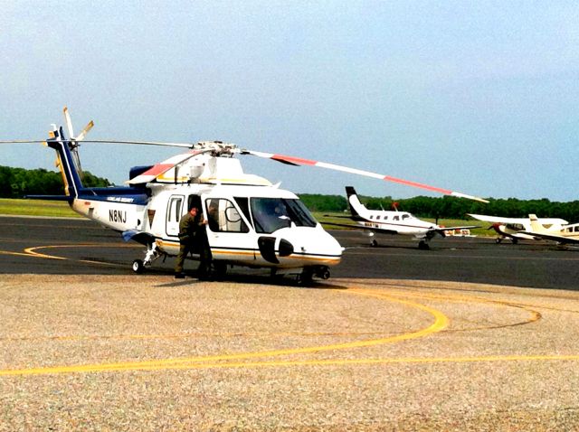 Sikorsky S-76 (N8NJ) - NJSP heli fueling @ Cape May Saturday May 28. With part of the ramp and taxiway being paved and all the Memorial Day visitors, the only open spot on the ramp was to pull in for fuel!