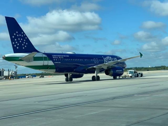 Airbus A320 (N531JB) - Blue Finest being taken from Gate 22 at CLT. 