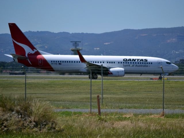 Boeing 737-800 (VH-VXE) - On taxi-way heading for take off on runway 05.