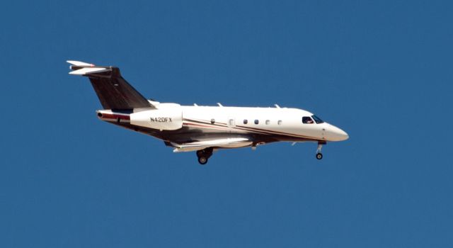 Embraer Legacy 450 (N420FX) - Right base to final for 09 at Carson City