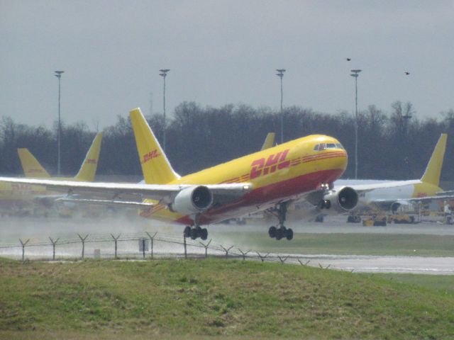 BOEING 767-400 — - An empty DHL 767 pulling up after only 3,000 feet of wet runway at CVG for a 15 minute flight to Wilmington Air Park (KILN) for repairs