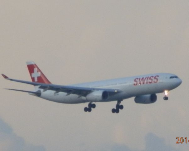 Airbus A330-300 (HB-JHK) - On final approach at dusk!
