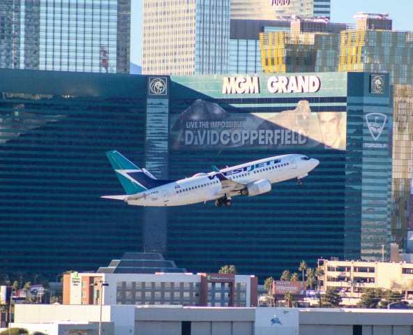 Boeing 737-700 (C-FWSY) - Spotting from parking garage, LAS, Jan 2025