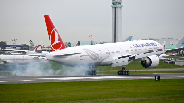 BOEING 777-300 (TC-JJY) - BOE537 makes tire smoke on landing Rwy 16R to complete a ferry flight from KVCV on 3/20/15. (ln 1287 / cn 44120).