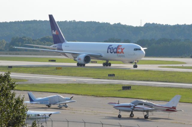 BOEING 767-300 (N123FE) - FedEx 795 is arriving from Memphis at 6:40 PM EDT.  Photo taken June 30, 2016 with a Nikon D3200 mounting 55-200mm VR2 lens set at F16 aperture.