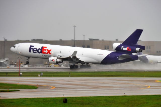 Boeing MD-11 (N624FE) - 5-R departure on 08-01-20 in the rain.