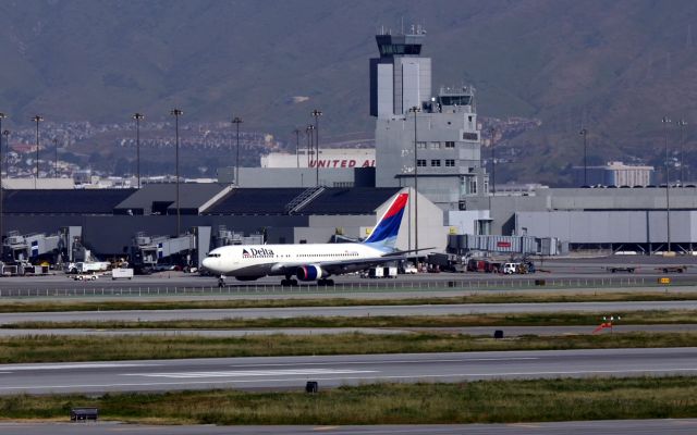 BOEING 767-200 (N105DA) - KSFO - Apr 5th, 2005 Delta 767-200 series passing the old tower. The upper unit will be torn down real soon ( 3/6/2017) the link below is a short blurb from what I heard from SFO photographers in this area. 