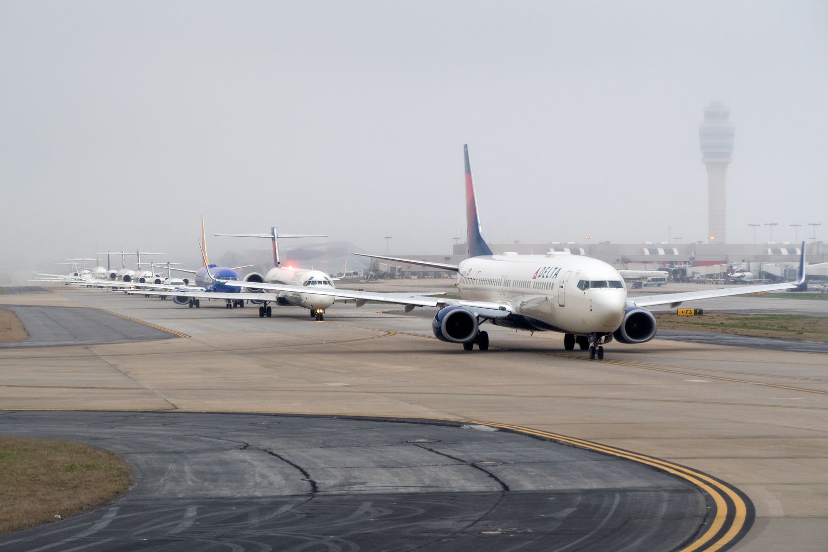 Boeing 737-800 — - Departure queue in Atlanta. How many aircraft can you count?