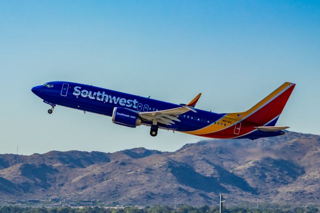 N8735L — - Southwest Airlines 737-800 taking off from PHX on 10/1/22. Taken with a Canon 850D and Rokinon 135mm f/2 manual focus lens.