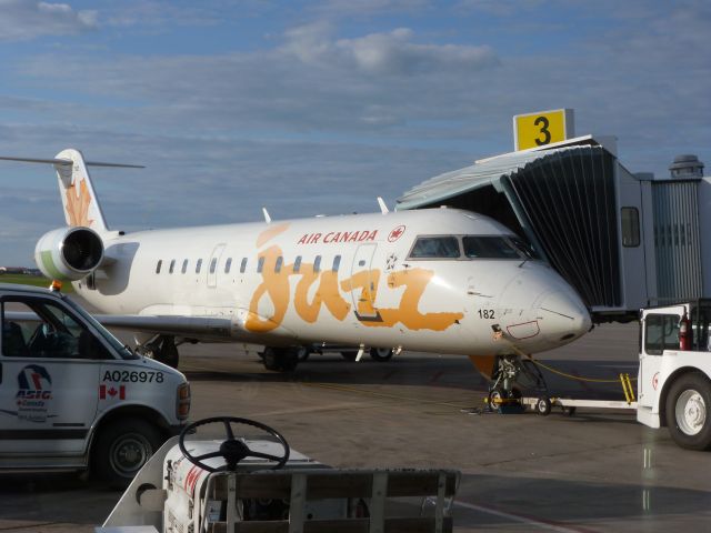 Canadair Regional Jet CRJ-200 (C-GKEM) - An Air Canada Jazz plane boarding passengers for a flight to Vancouver. 