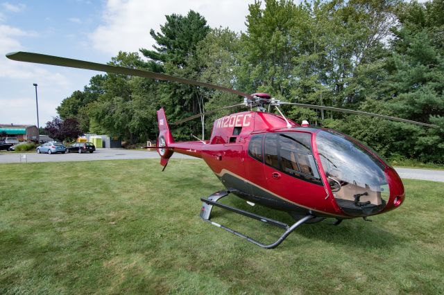 Eurocopter EC-120 Colibri (N120EC) - 120EC sitting in the parking lot at Minute Man Municipal. I guess that's one way to avoid airport fees! This helicopter had a brief cameo in the 2016 “Superman vs Batman” movie.