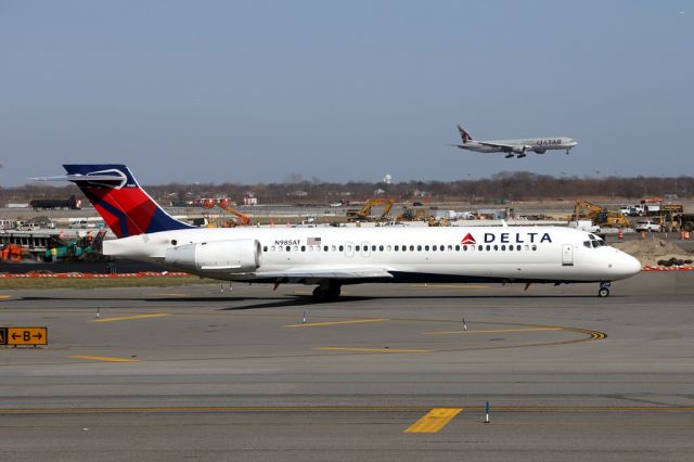 Boeing 717-200 (N985AT) - DAL2649 to Tampa with A7-BAC, QTR701, landing in the background.  6 April 2015