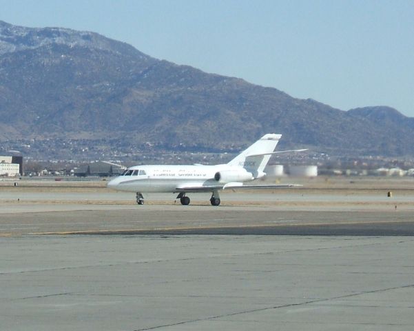 Dassault Falcon 20 (N229CK) - Kalitta Charters aircraft bringing home the body of a fallen he taxis to the Cutter Aviation flight line at KABQ.  Notice the MC130s in the background.  KABQ is also used by Kirtland AFB.