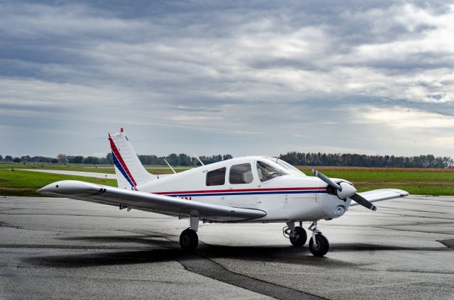 Piper Cherokee (N4361X) - Piper Cherokee 140 on the ramp in Ames on a cloudy day. Photo Copyright Dylan Clements, dclements.com