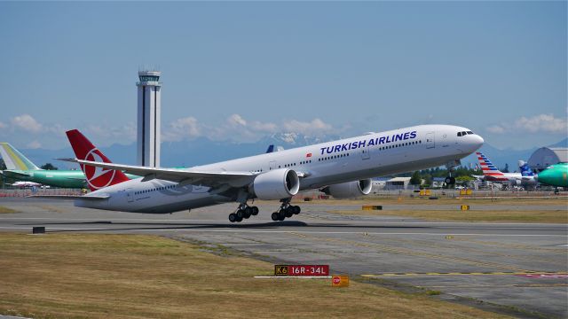 BOEING 777-300 (TC-JJS) - THY6900 on rotation from Rwy 16R for its delivery flight to LTBA / IST on 7/26/14. (LN:1222 / cn 44117).