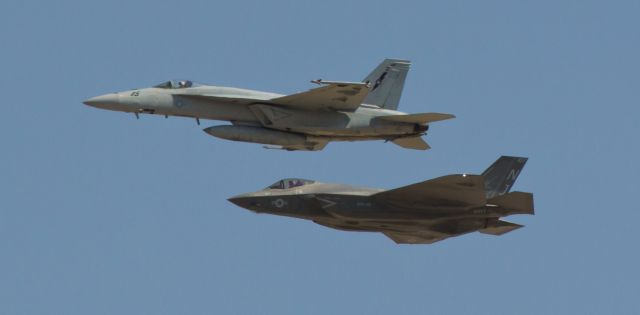 16-6904 — - My "Lightning Bug" picture shows a NAWDC F/A-18E Super Bug and a VFA 101 "Grim Reapers" F-35C Lightning II as they return to NAS Fallon from a midday training sortie.  I was straining the reach of my 70-300, the temp was in the high 90s, and the midday light was harsh so the shot is not UHQ, but I had to play the hand the spotters gods dealt.  It is my first capture of an F-35C so I am pleased to have this click.