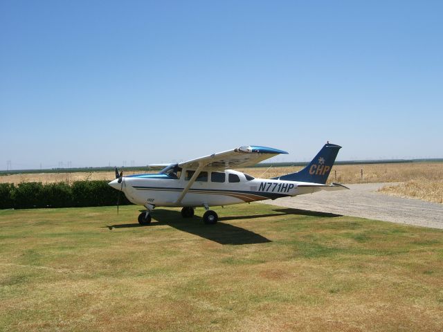 Cessna 206 Stationair — - CHP Cessna 206 at Harris Ranch For lunch.  I guess this is what they mean when "patrolled by aircraft".  I stopped by for lunch and saw the CHP airplane. Kind of ironic, they can write you a ticket for 75 mph on Interstate 5, but I can pass them at 200 mph in my Cessna T210